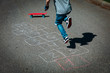 © nadezhda1906 - little boy playing hopscotch on playground