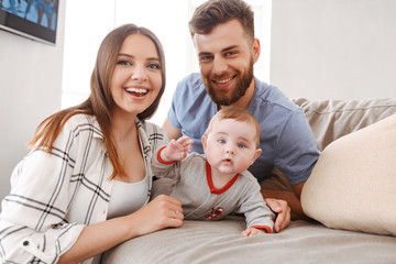 happy young family. parents having fun with their little child