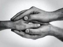 Concept Of Caring, Tenderness, Protection. Male And Female Hands Touch Each Other.