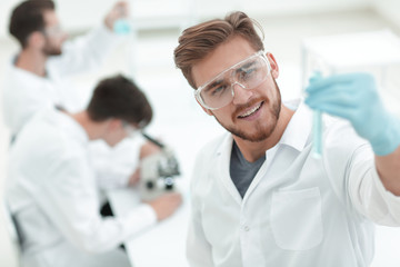 Wall Mural - closeup. scientist with beaker