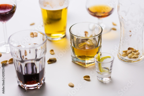 Cuadros en Lienzo alcohol addiction and drunkenness concept - glasses of different drinks on messy