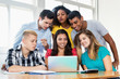 © Daniel Ernst - Professor teaching web design with group of students