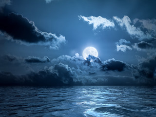 full moon over the ocean