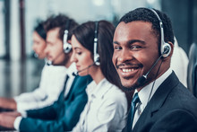 Multicultural Young Happy Employees In Call Center
