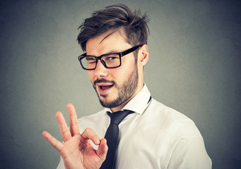 Ironic man showing OK gesture