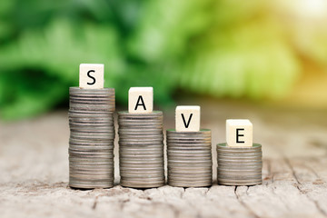 SAVE on coins stack for saving money and financial planning concept