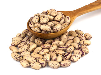 Haricot beans in a wooden spoon  isolated on white background