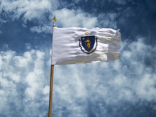 Massachusetts Flag USA Flag Silk Waving Flag Made Transparent Fabric Of Massachusetts US State With Wooden Flagpole Gold Spear On Background Blue Sky White Smoke Cloud Real Retro Photo 3d Illustration