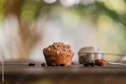 Fotografie, Obraz Mocha muffins and ingredients on a rustic wooden table