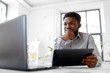 © Syda Productions - business, people and technology concept - african american businessman with laptop and tablet pc computer at office