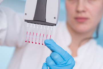 Wall Mural - Young woman with genetic research in the laboratory research of cancer diseases