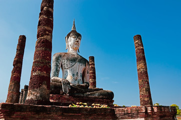 Sukhothai Wat Mahathat Buddha statues at Wat Mahathat ancient capital of Sukhothai, Thailand. Sukhothai Historical Park is the UNESCO world heritage