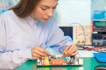 Wall Mural - girl student in the class physics and electronics