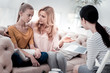 © Viacheslav Yakobchuk - Share your feelings. Excited mother sitting closely to her daughter and talking while experienced psychologist listening to them