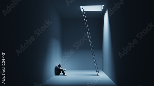 Fotomural A man is sitting depressively in a room with a ladder