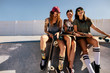 Group of smiling women at skate park