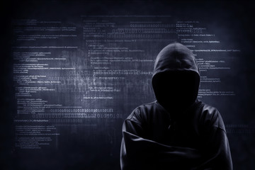 internet crime concept. hacker working on a code on dark digital background with digital interface a