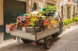 Small truck filled with vegetables and fresh fruits