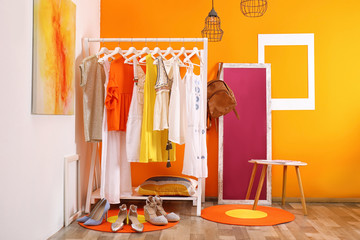 Wall Mural - Stylish dressing room interior with clothes rack and mirror