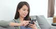 © leungchopan - Young woman use of smart phone at home