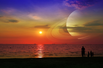Wall Mural - Saturn near earth on night sky over the sea and sunset