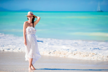 Caucasian girl with hat background the sea