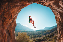 The Climber Is Hanging On A Rope.