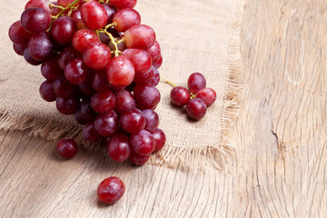 bunch of red grapes on old wood