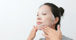 © leungchopan - Woman apply paper mask skin care