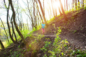 Girl running in the woods..