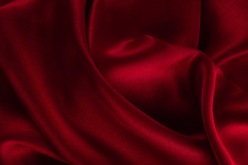 Abstract silk luxury background, piece of cloth, deep red cloth texture