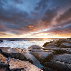 Wall Mural - Seascape during storm and sunrise. Natural seascape in the Norway