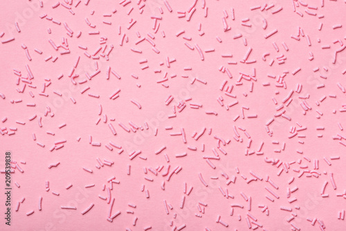 beautiful pink sprinkles dots on background, flat lay