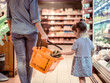 Mom and daughter are shopping at the supermarket