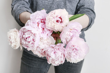 Canvas Print - Woman holding pink peonies.