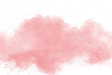 abstract pink powder explosion on white background. freeze motion of pink dust splattered.