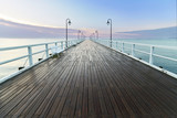 Fototapeta Maki - Wooden pier at sea shore, morning view, Gdynia Orlowo poland