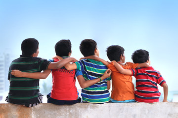 Friends Sitting on Wall