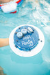 blue cake on the background of the pool