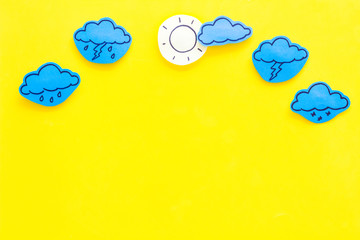 Wall Mural - modern weather icons set on yellow background top view copy space