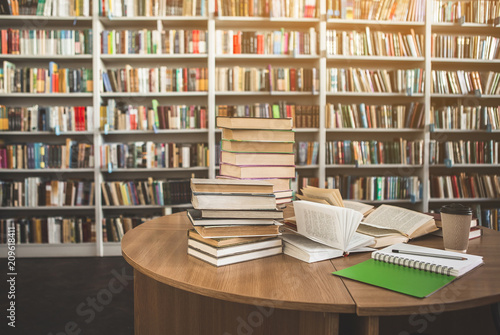 Fotografía Volumes locating on table and shelves