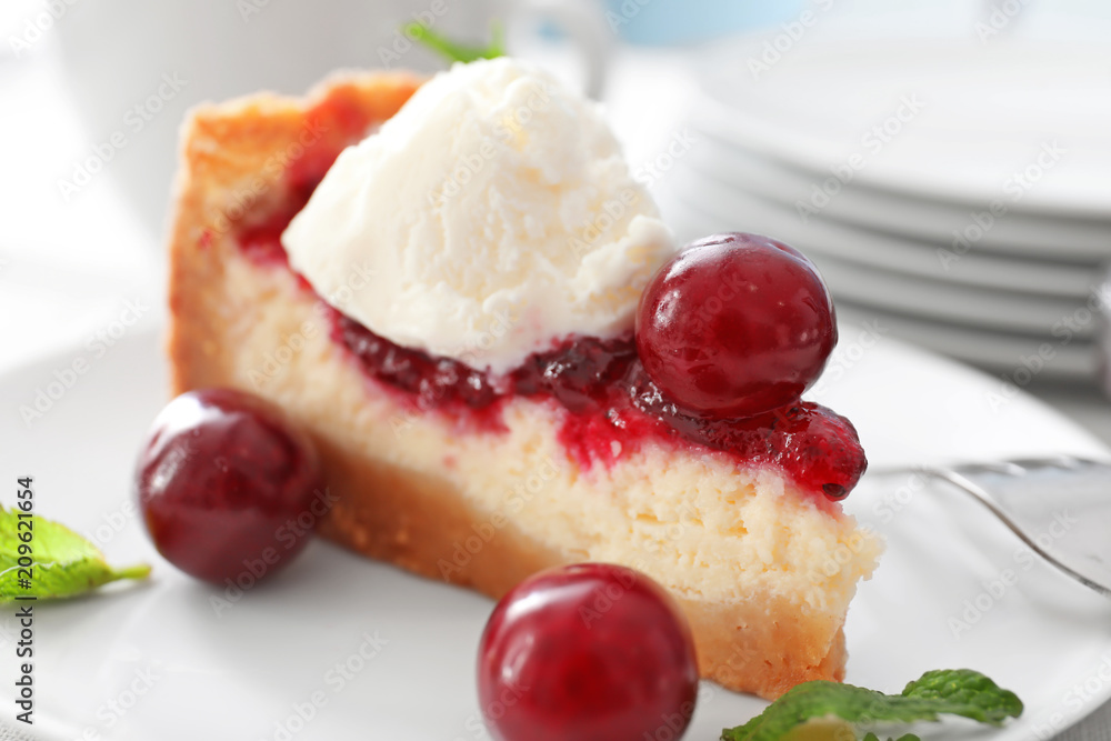 Delicious cheesecake with cherries on plate, closeup