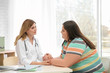© New Africa - Female doctor consulting overweight woman in clinic