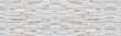 © torsakarin - Panorama of Modern Brown and white stone wall pattern and background