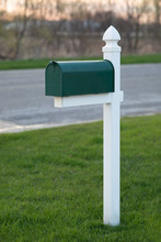 Green Mailbox On Grass Lawn 