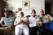 © Rawpixel.com - Group of senior friends sitting and watching tv together