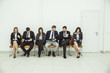 © yurolaitsalbert - business team with documents before the working meeting, sitting in office chairs in the lobby of the conference hall