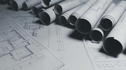 Seamless loopable animation of a stack of white blueprints on the table.