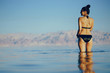 © prostooleh - brunette girl swimming in the dead sea