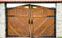 Part Of A Wooden Gate With A Metal Ring Handle